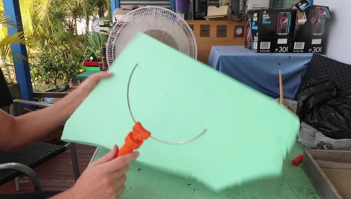 Use a hot wire foam cutter to carve and shape the foam, creating a natural-looking curvature.