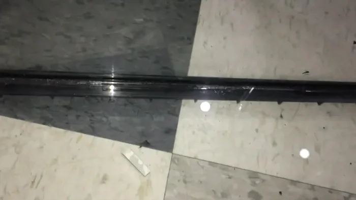 Carefully remove the old silicone sealant around the leak using an Exacto knife. Wear safety glasses to protect your eyes from flying glass shards.