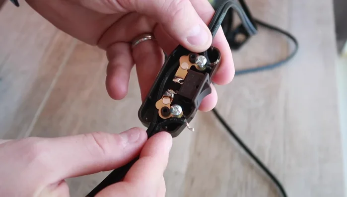 If necessary, trim the ends of the cut wire to remove excess insulation, ensuring enough bare wire to wrap securely around the screws on the new switch.