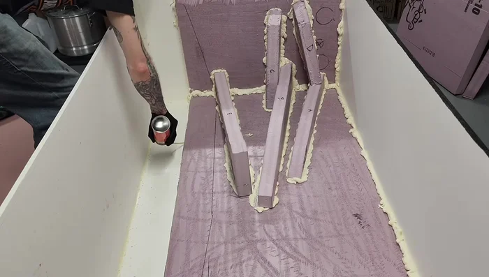 Spray foam the bottom seam and dampen with water to help cure.