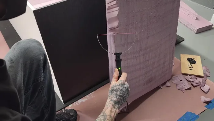 Use a hot wire foam cutter to add detail to side panels. Wear a mask.