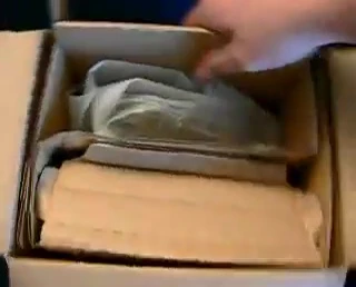 Close-up shot of the Repti Shelter box being opened.