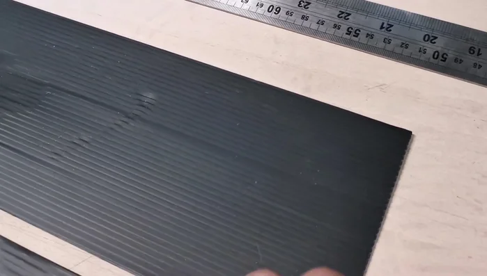 Use a steel rule and sharp knife to cut along the ridges for straight lines. For side pieces, use a set square for precise cuts.