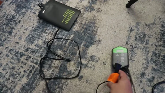 Place the metal probe inside the tank, preferably directly above the heat mat and tape it securely to prevent displacement.