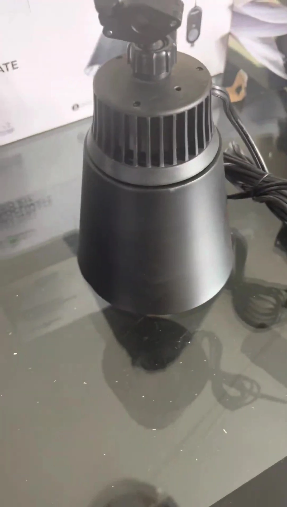 The speaker showing the process of scanning the barcode and downloading the app.