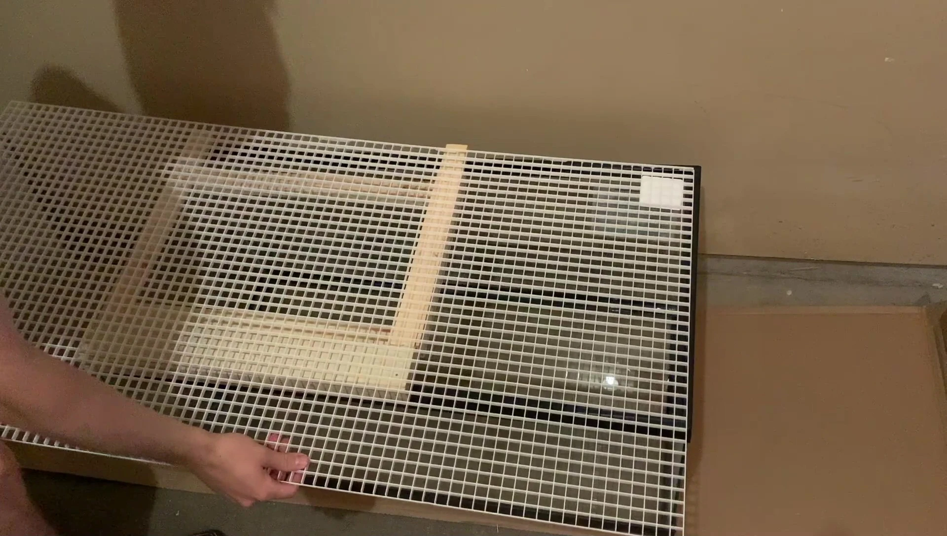 Cutting the egg crate cover.