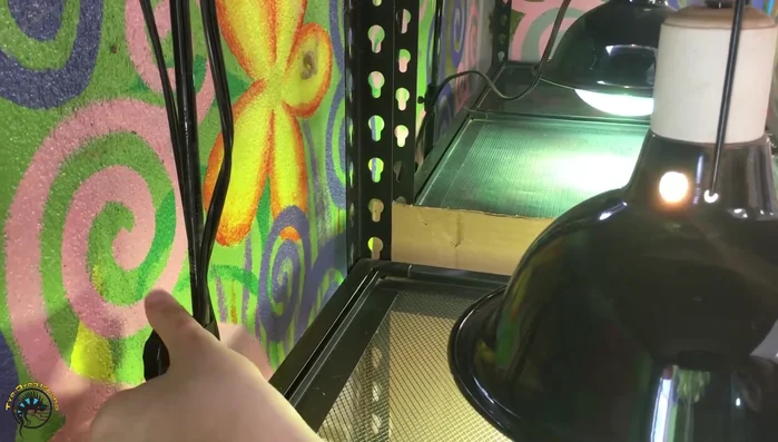 Tighten the knob to secure the lamp in the desired position.