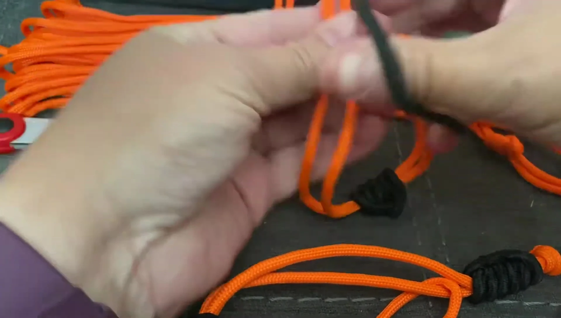 Wrapping the second hair elastic around the paracord.