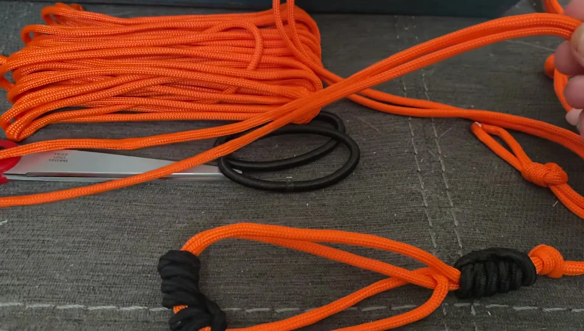 Close-up shot of paracord being measured.