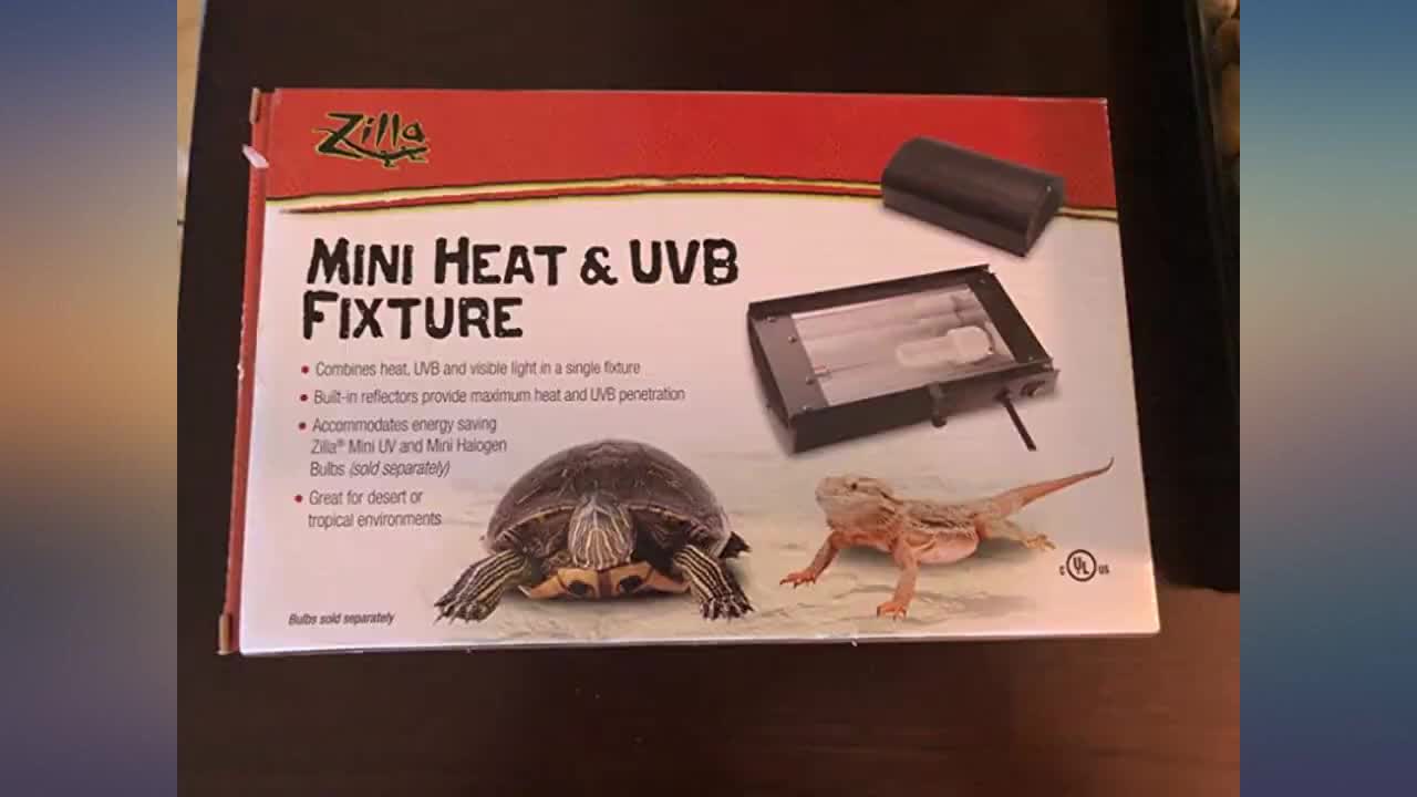 Close-up of the Zilla Mini Heat UVB Fixture mounted on a terrarium, highlighting its compact size.