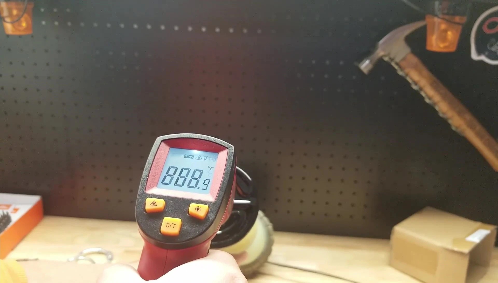The tester commenting on the unexpectedly high temperature of the bulb.