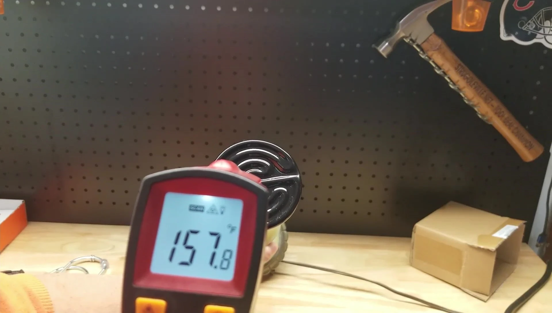 Infrared thermometer displaying the initial temperature reading of the bulb.