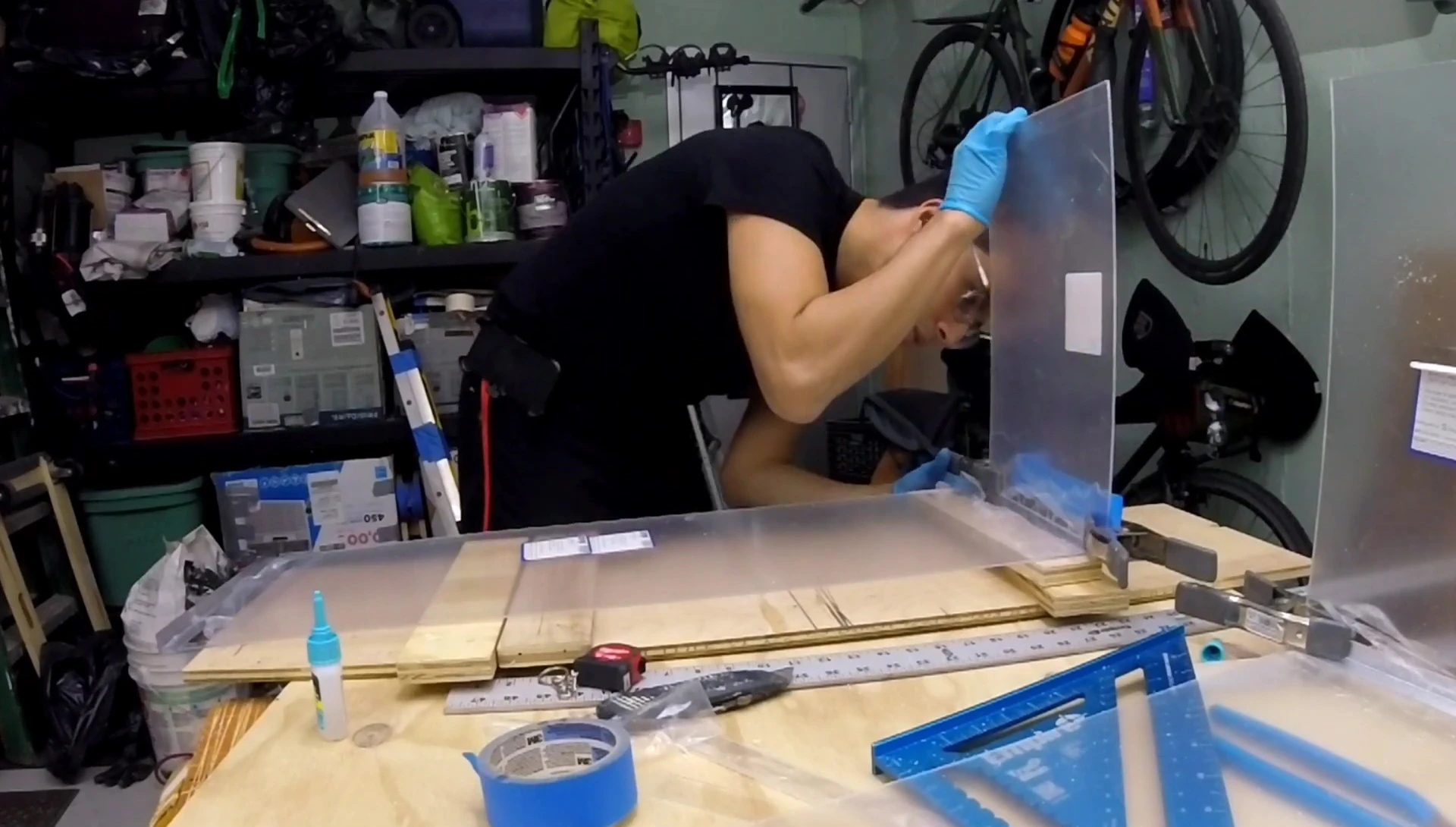 Applying superglue to bond the aluminum and plexiglass.