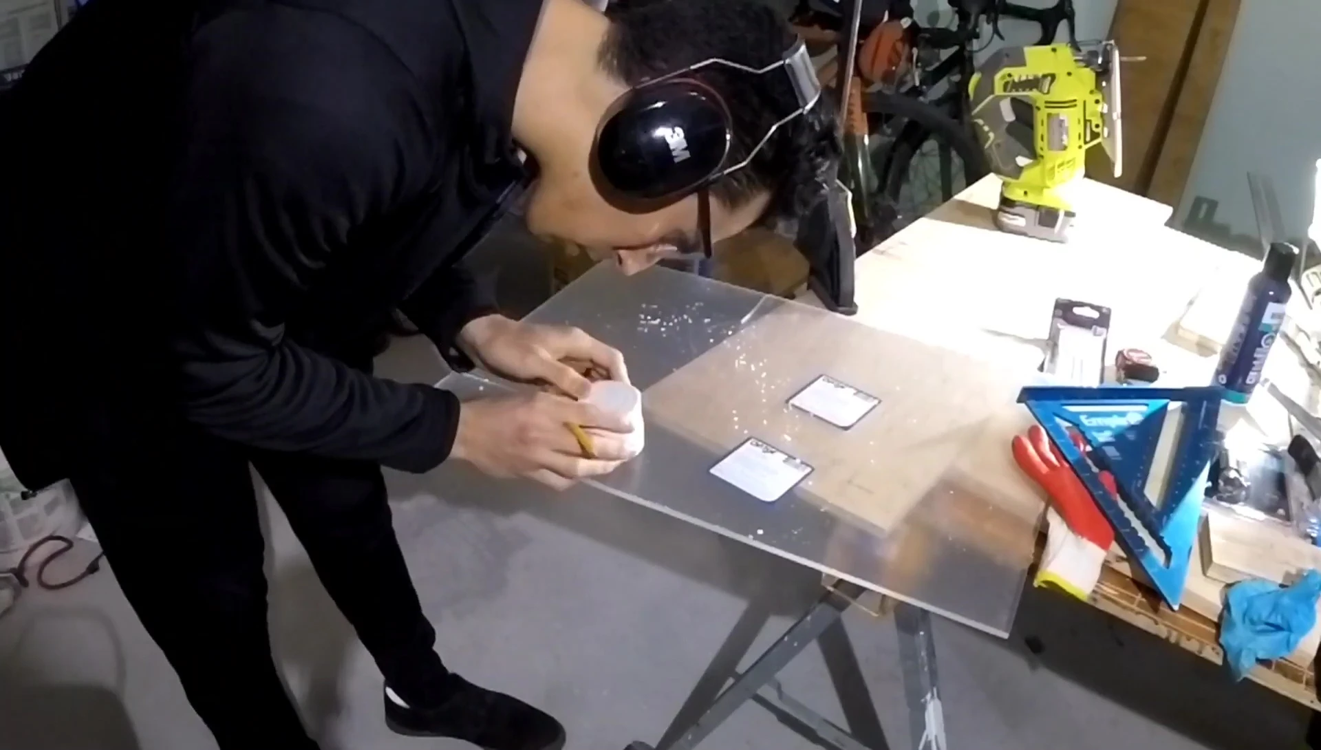 Cutting plexiglass for the ramp and platform using a jigsaw.