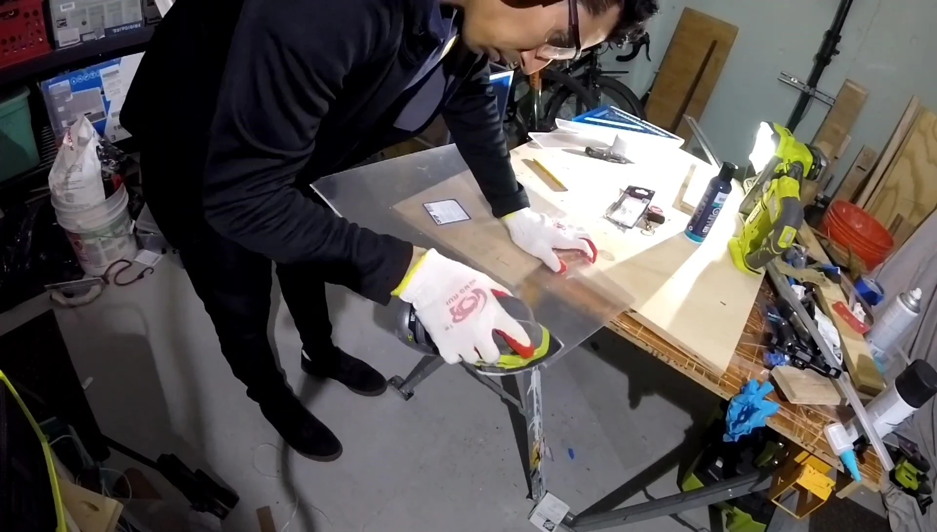 Sanding down rough edges on the plexiglass.