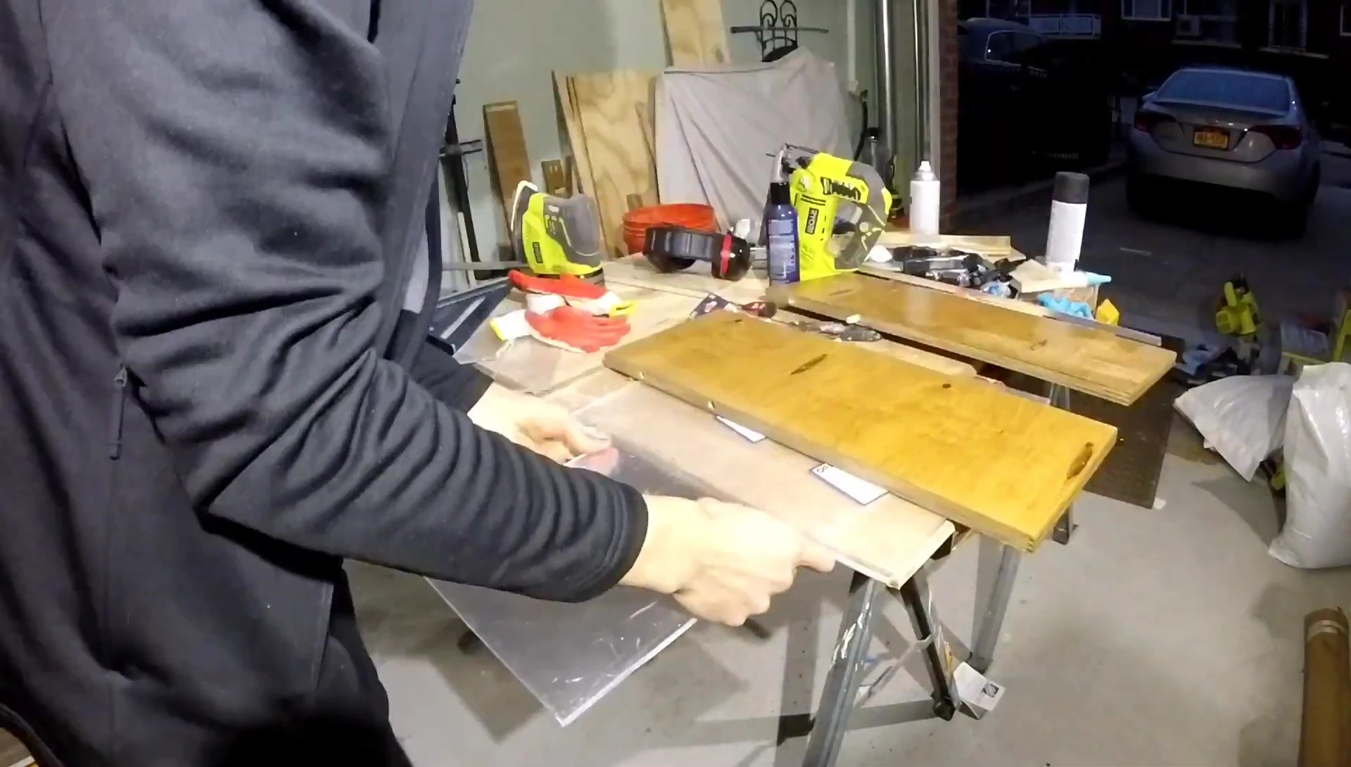 Bending the plexiglass using clamps and a propane torch.