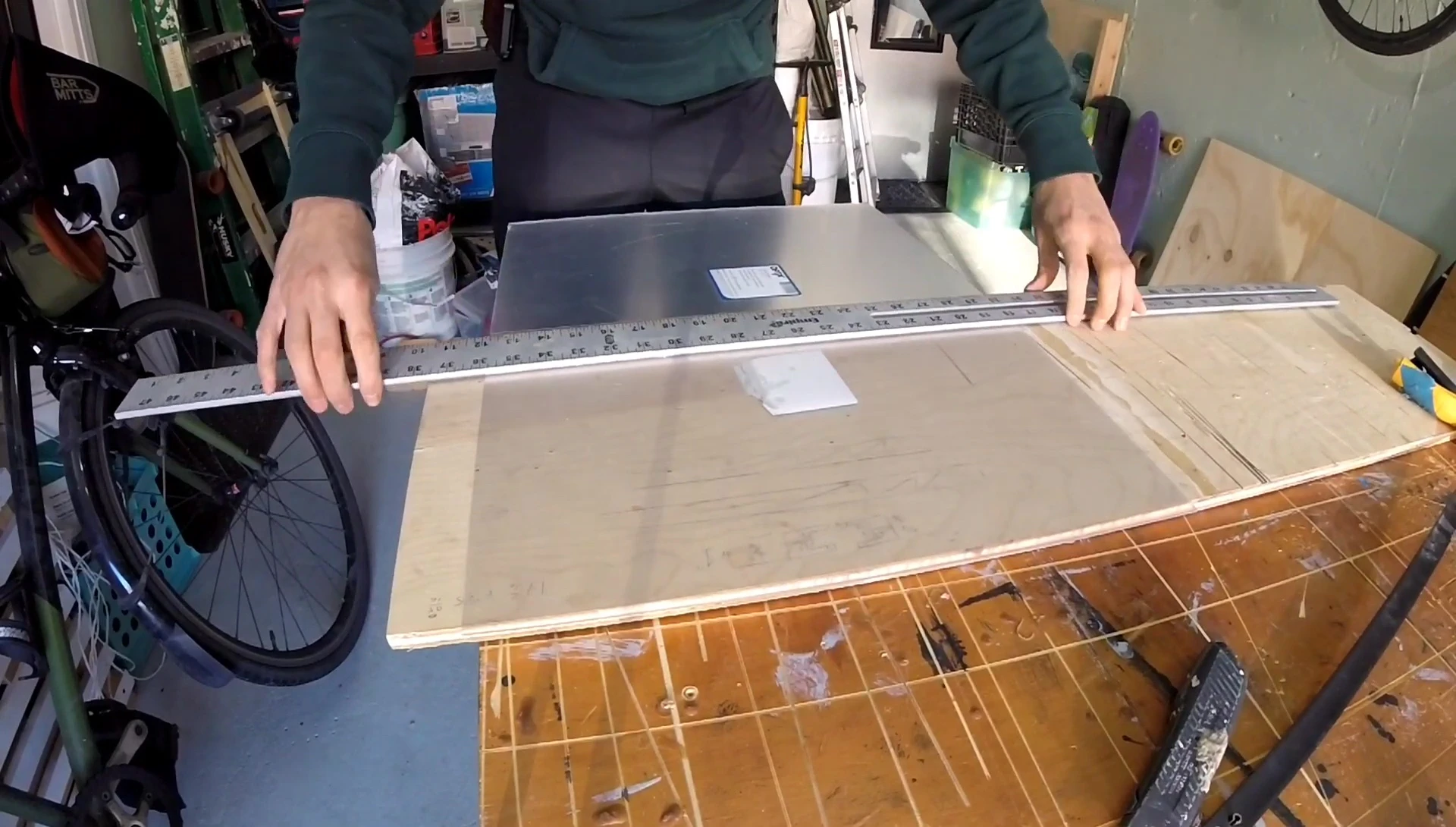 Demonstrating the use of a straightedge for accurate cuts.