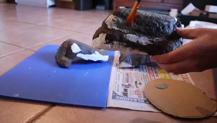 Apply a base coat of paint to the entire rock.