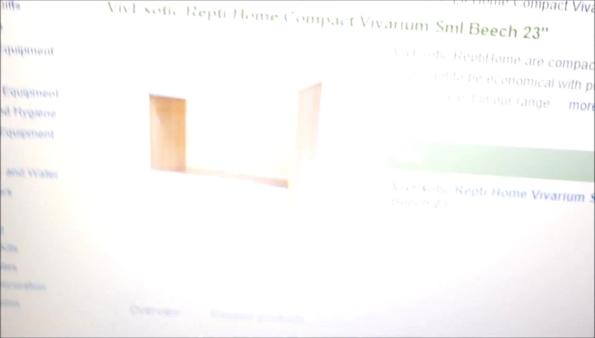 The speaker is holding a wooden vivarium