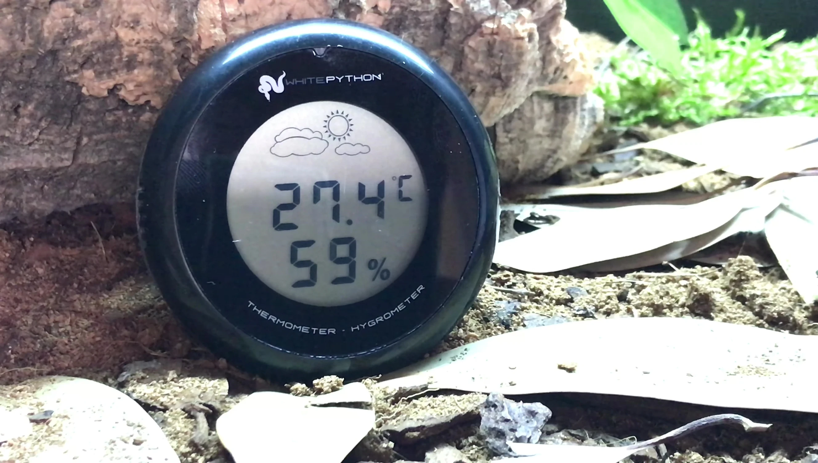 Close-up of the device displaying humidity reading