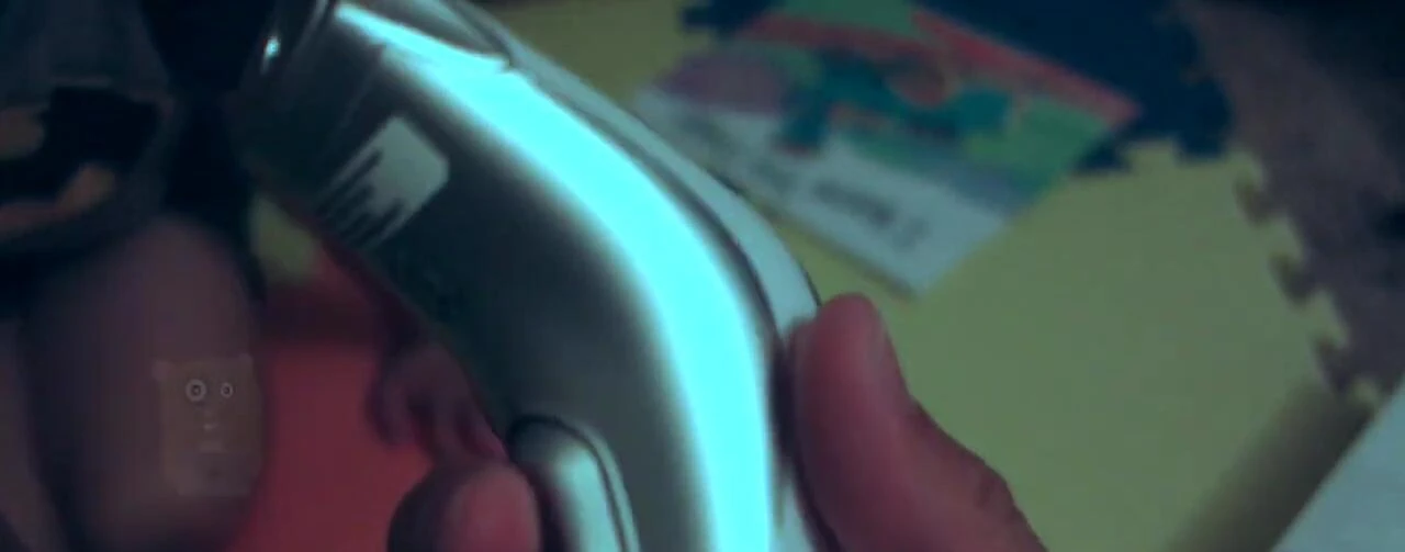 The hand demonstrating the trigger button.