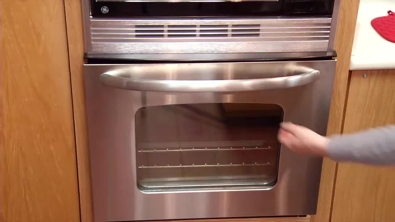 A close-up shot of a person cooking meat