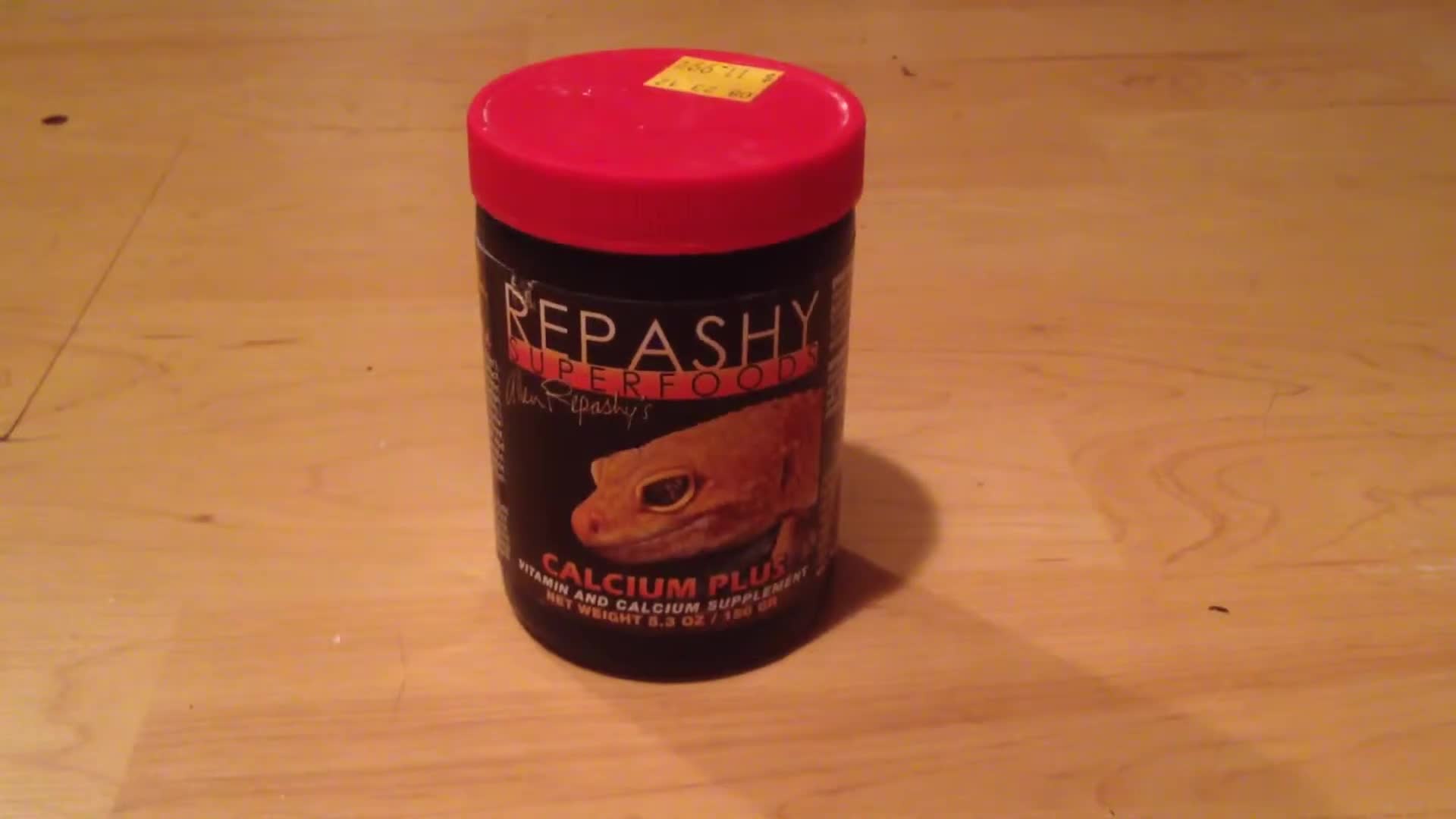 Close-up of the Repashy Superfoods Calcium Plus container