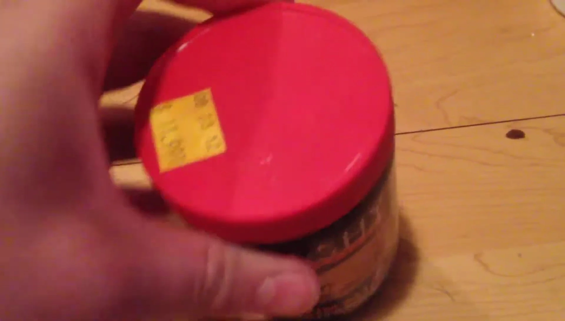 The reviewer showing the open container