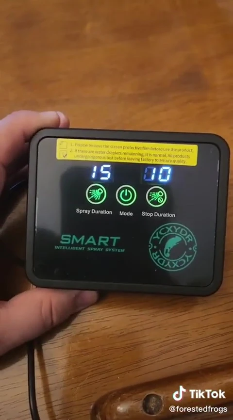 Close-up of the SMART Reptile Mister's digital control panel.