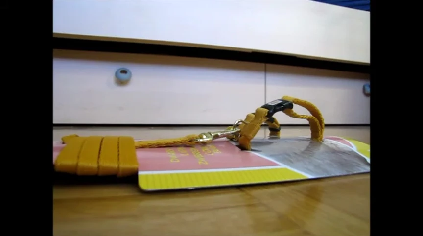 Close-up of the harness package being opened.