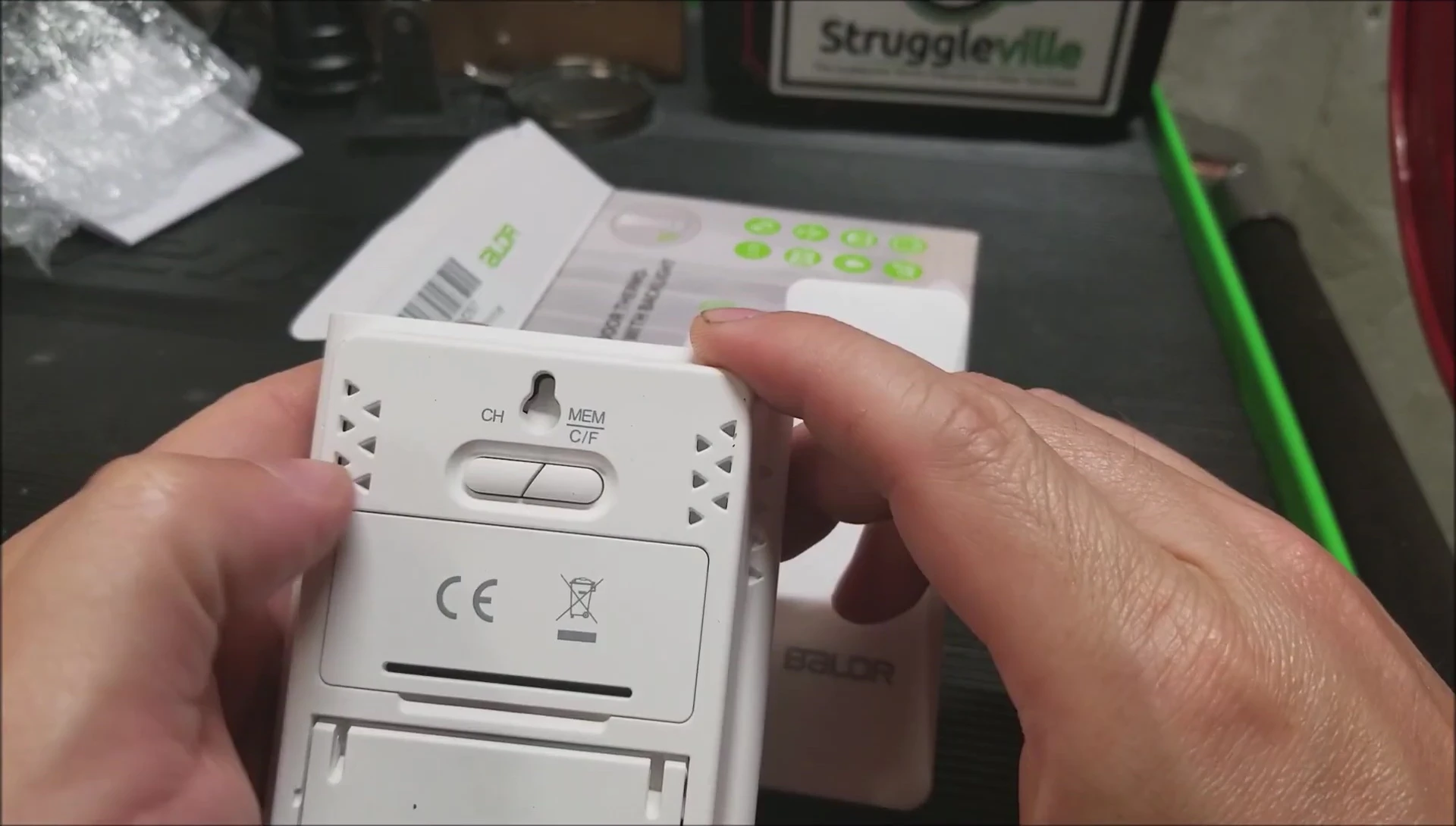 Display showing channel selection button.