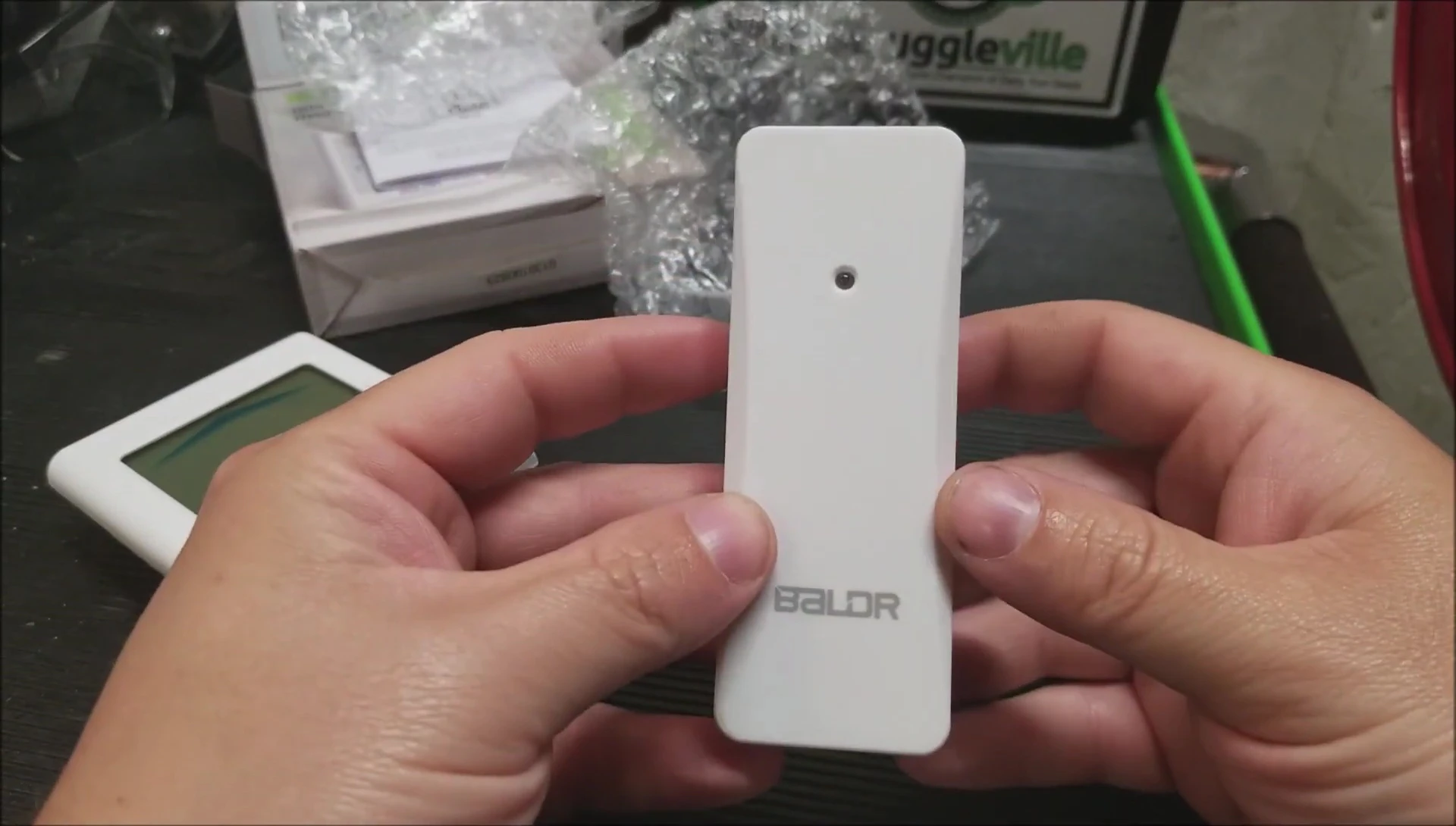 Highlighting the indoor/outdoor temperature and humidity monitoring capabilities.