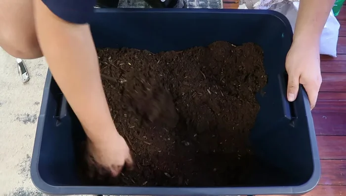 Add the topsoil. A smaller amount is key (approximately 15% of the total mix).