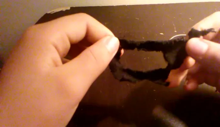 Cut out the inside of the box shape on the sock to make space for your pet's arms.