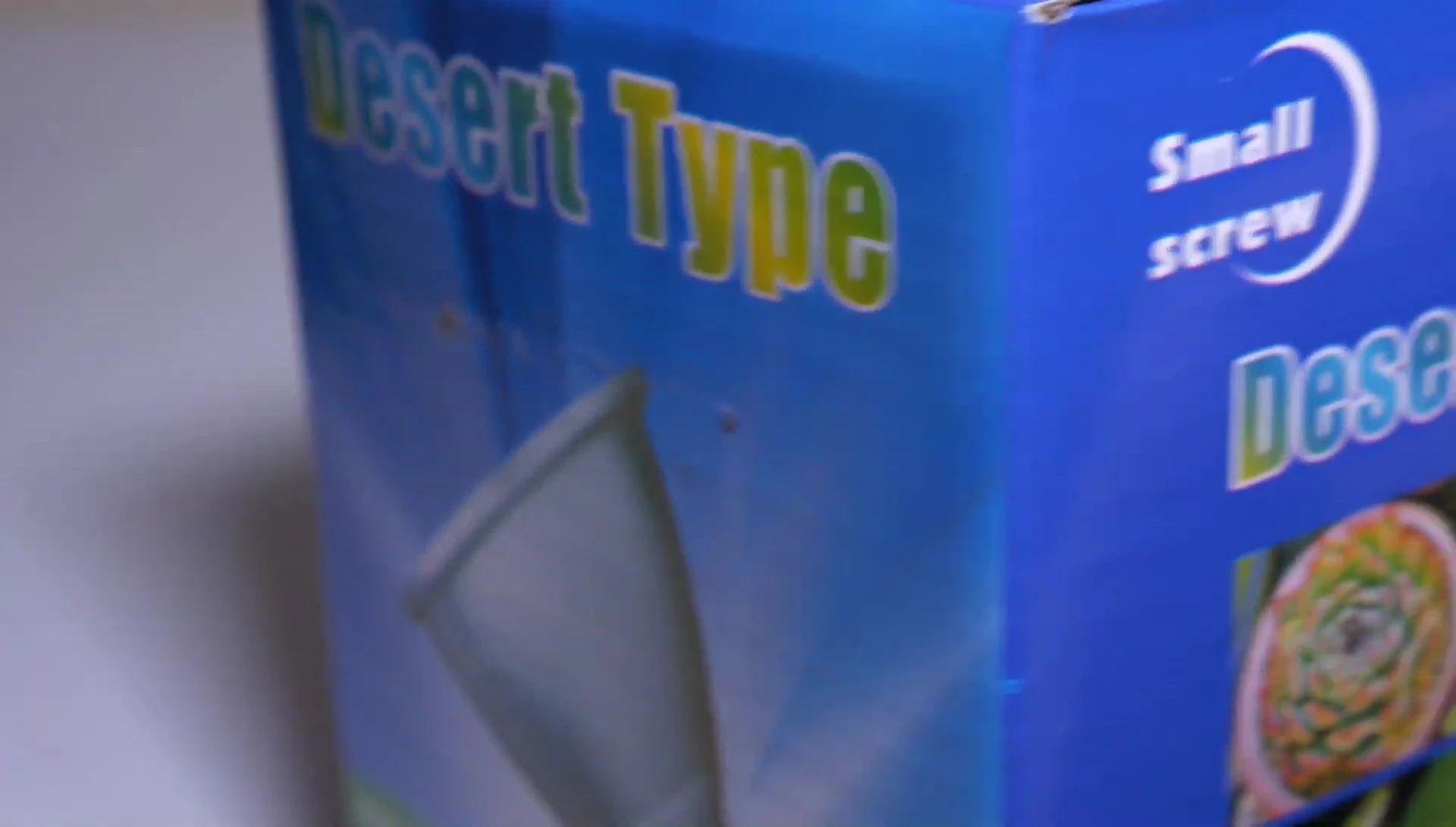 Close-up of packaging details, including screws