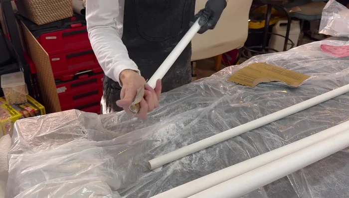 Prepare PVC pipes: Sand down the surface and wipe with a wet rag to remove dust.