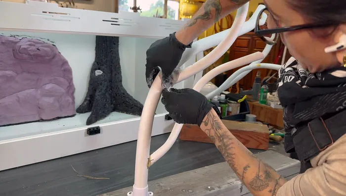 Assemble branches: Use hot glue, screws, and masking tape to attach branches together, creating a basic structure.