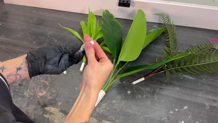 Create ground mounts: Use PVC and PEX pipes, epoxy clay mounds and silicone to mount plants upright on the enclosure floor.
