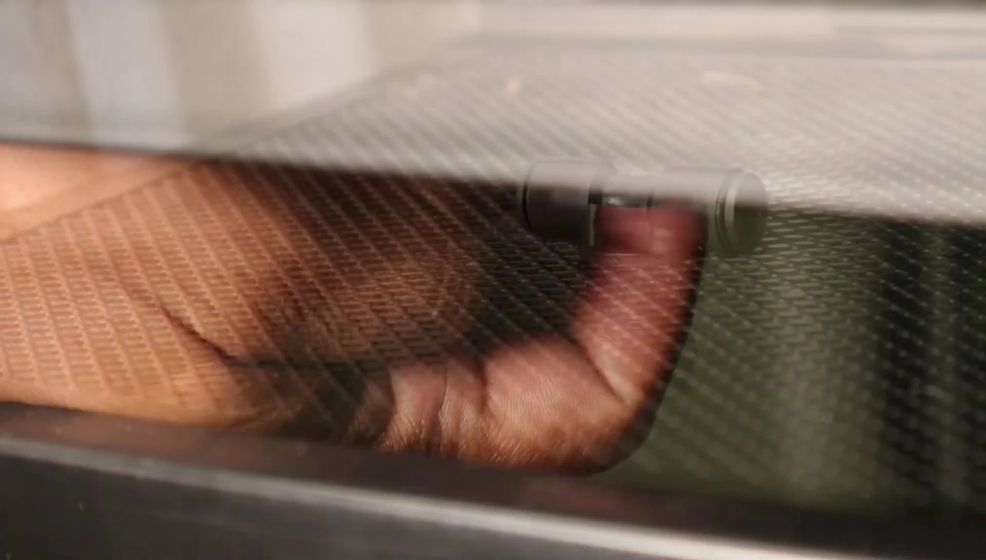 A spray nozzle is shown installed in the enclosure top.