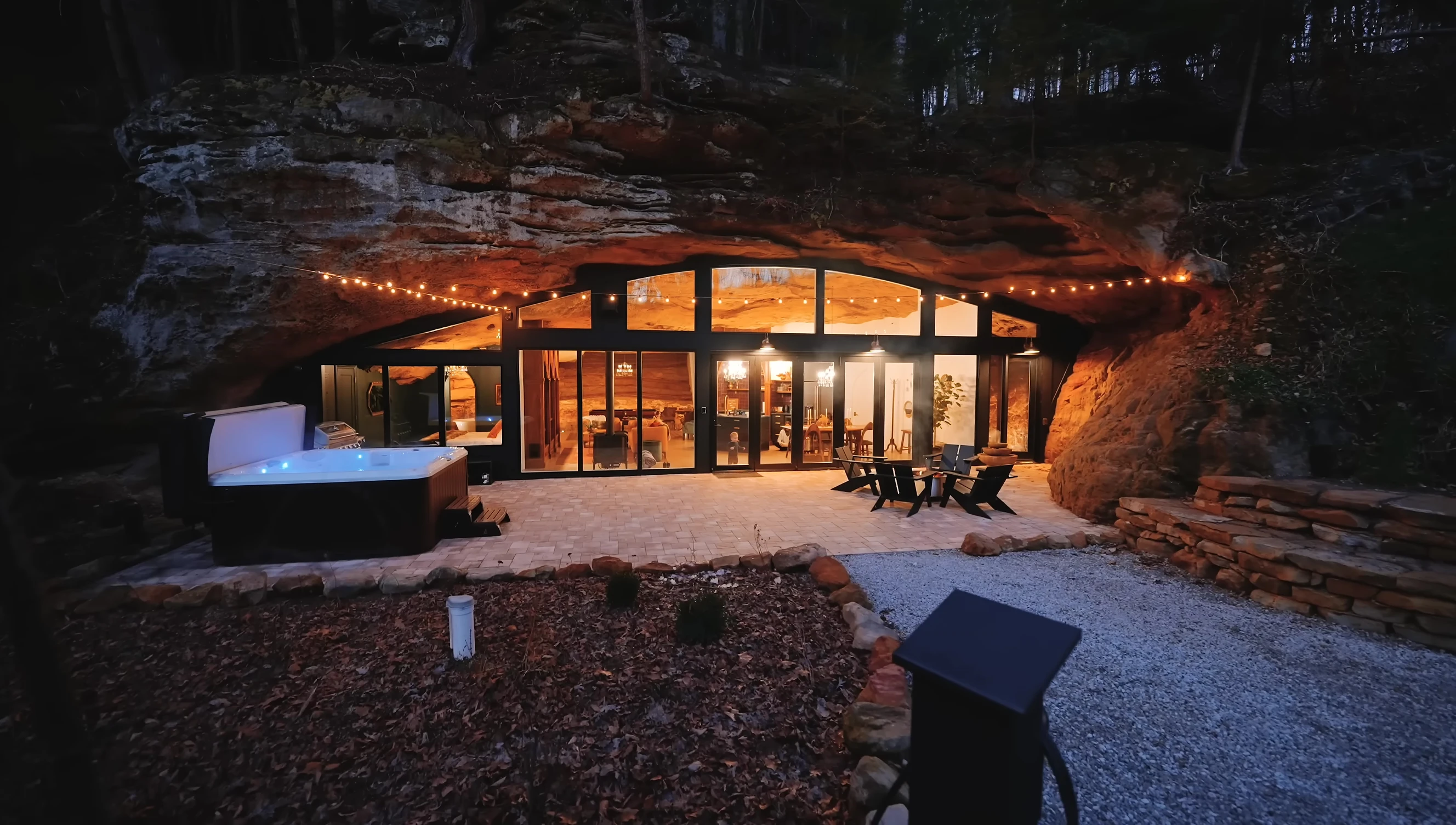 Close-up of the patio area with the fireplace and hot tub.
