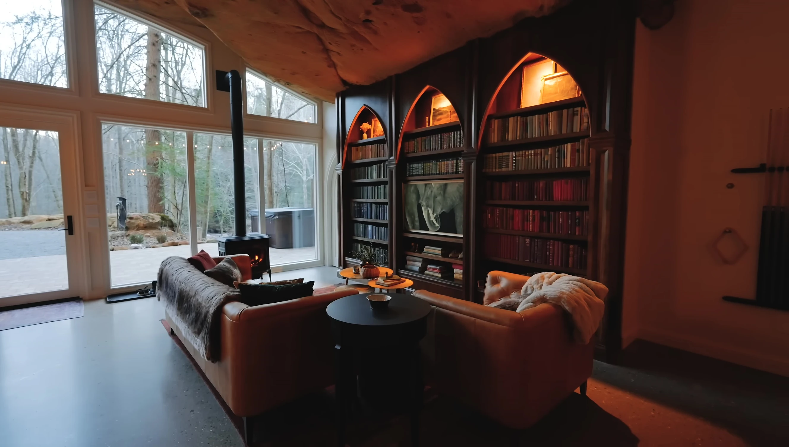 The living room with its impressive bookshelf.