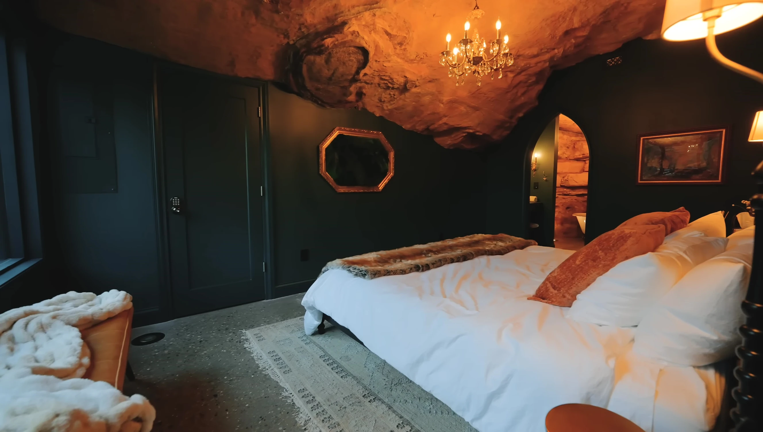 The first bedroom with its green color scheme and natural light.