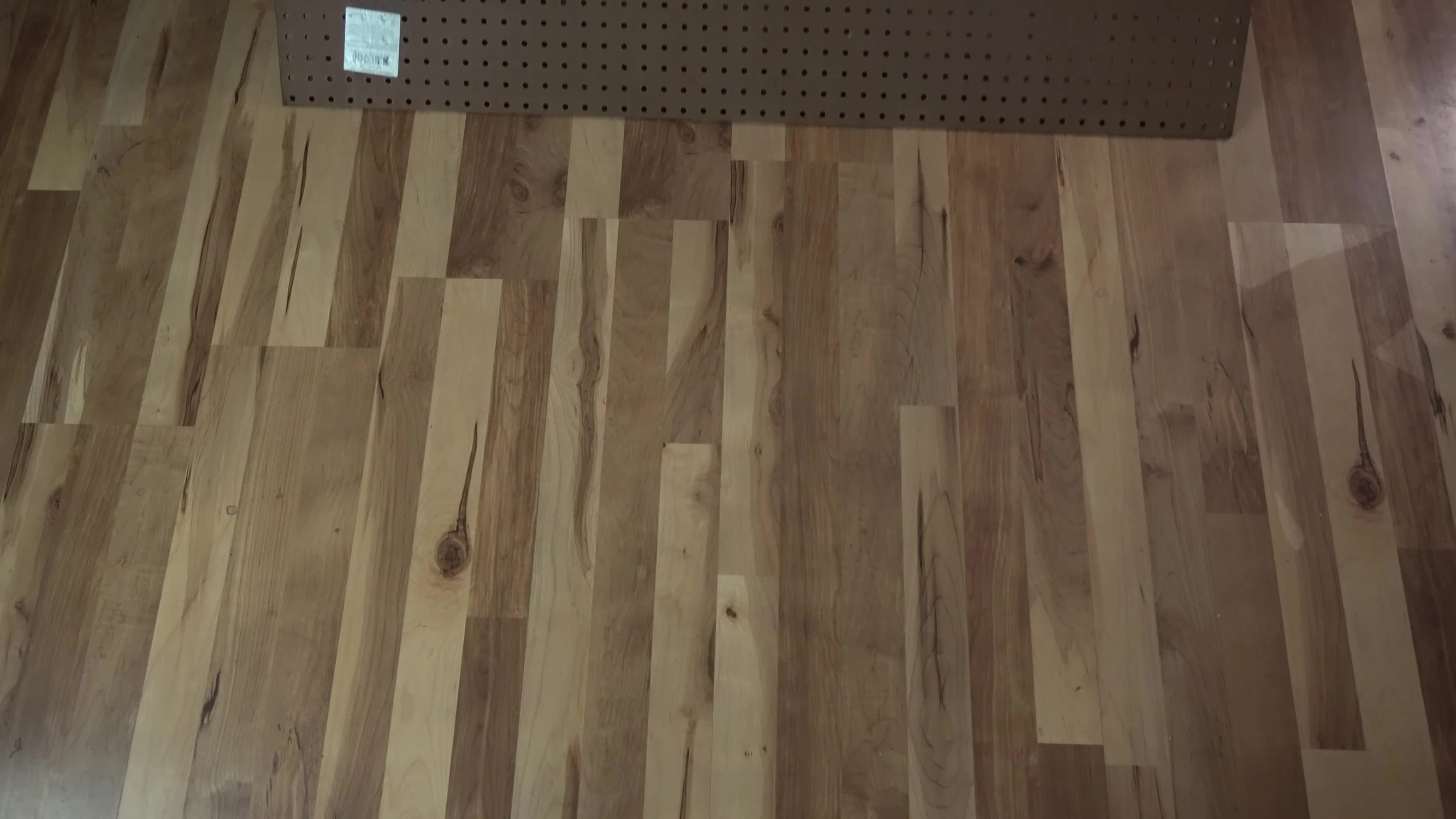 Pegboard being painted black