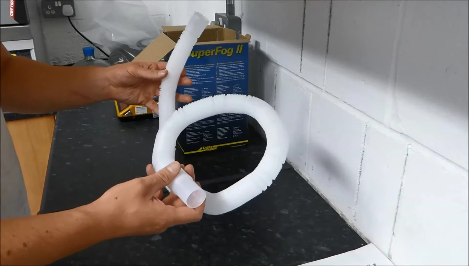 Comparison shot highlighting the length difference between the Superfog 2 and Repti Fogger hoses.